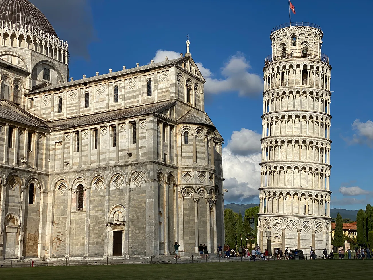 The Leaning Tower of Pisa, a cylindrical white tower in Pisa, Italy, famous for its tilt