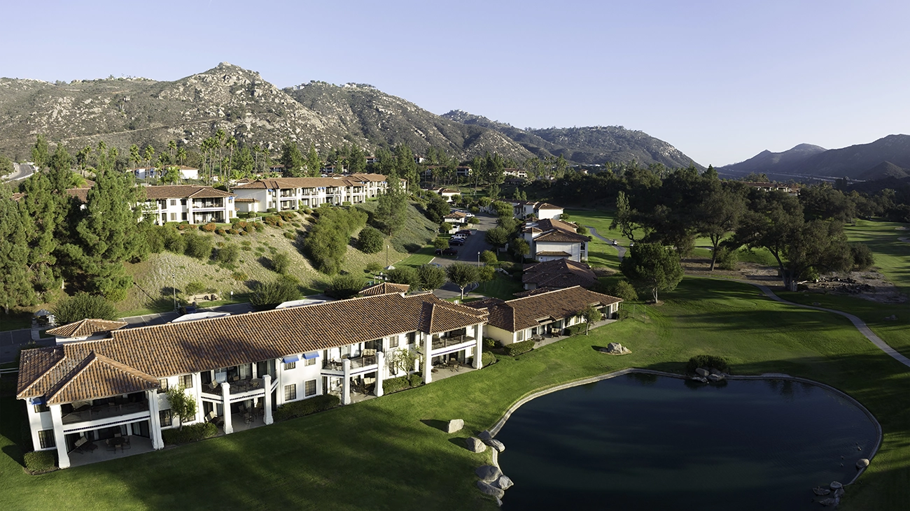 The Welk Resort sits at the base of the mountains under a blue sky