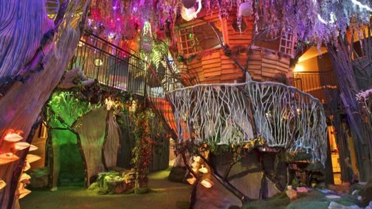 A colorful arts center at Meow Wolf with ambient lights